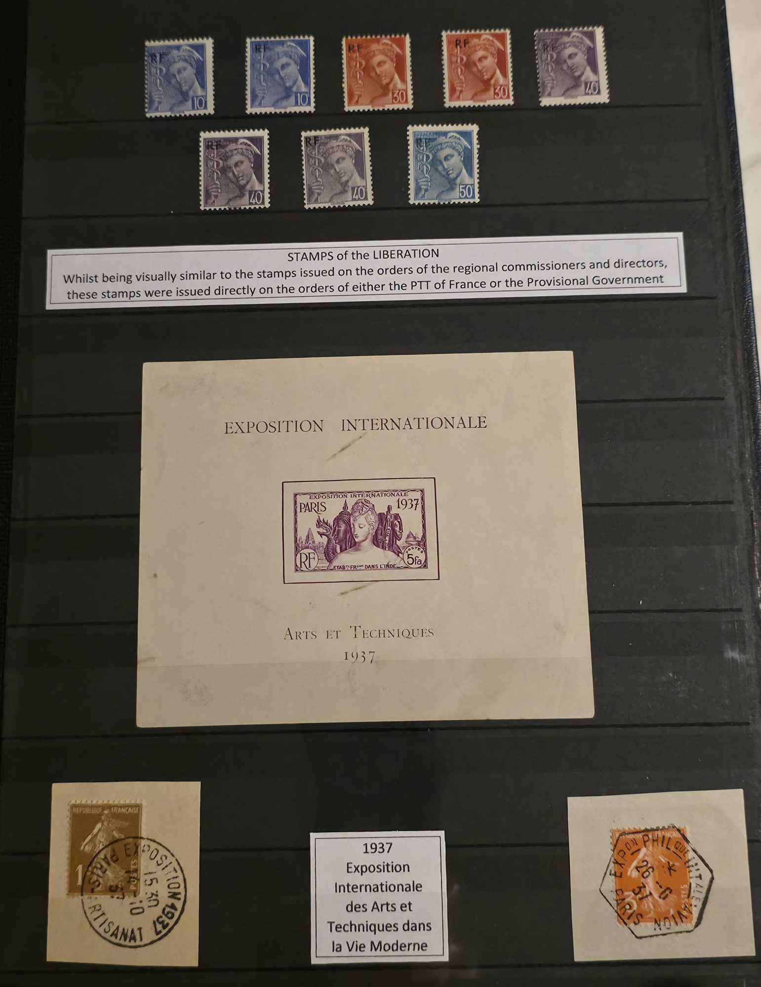 a collection of postage stamps on a black board