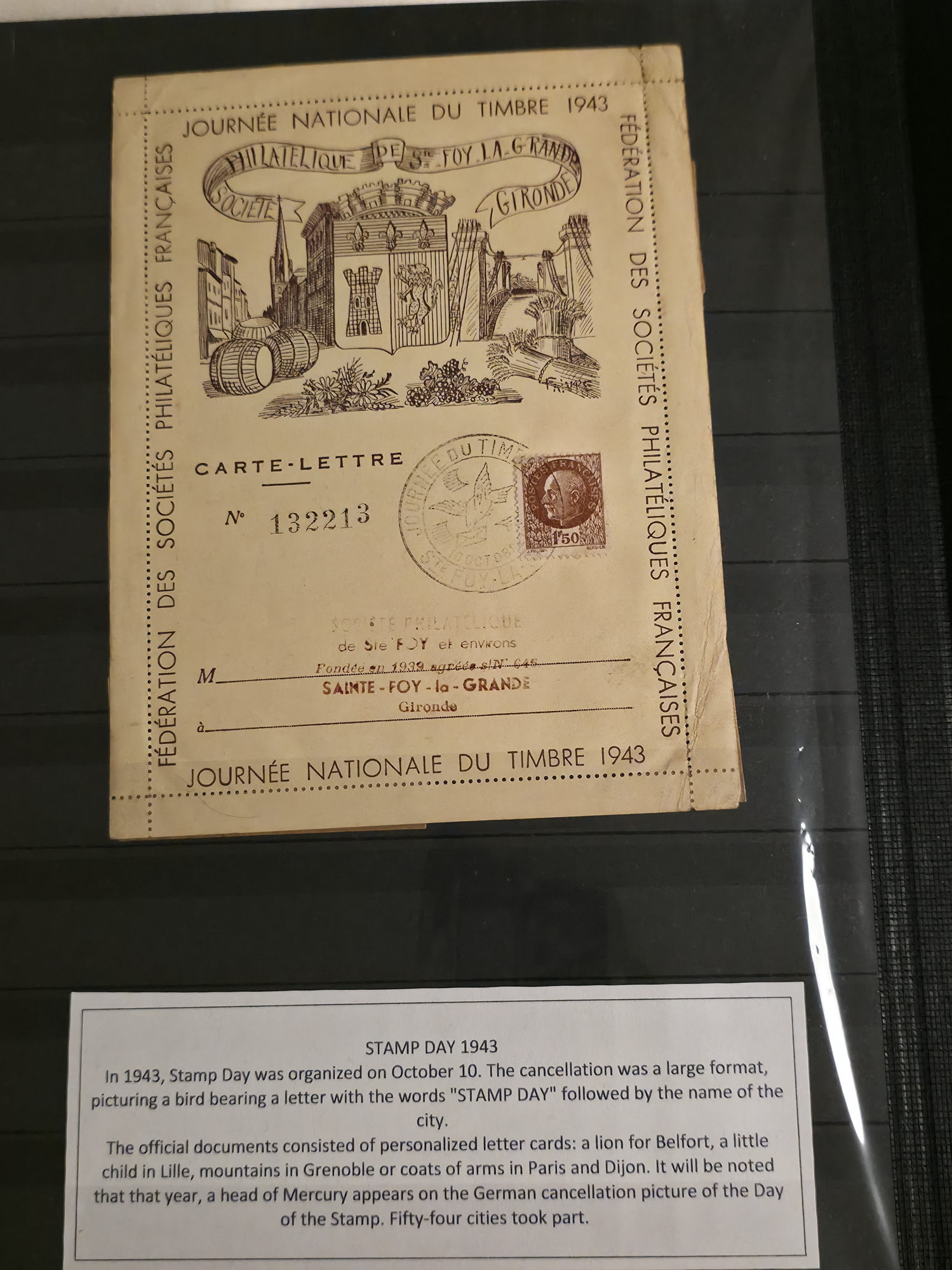 a piece of paper with a picture of buildings and a sign