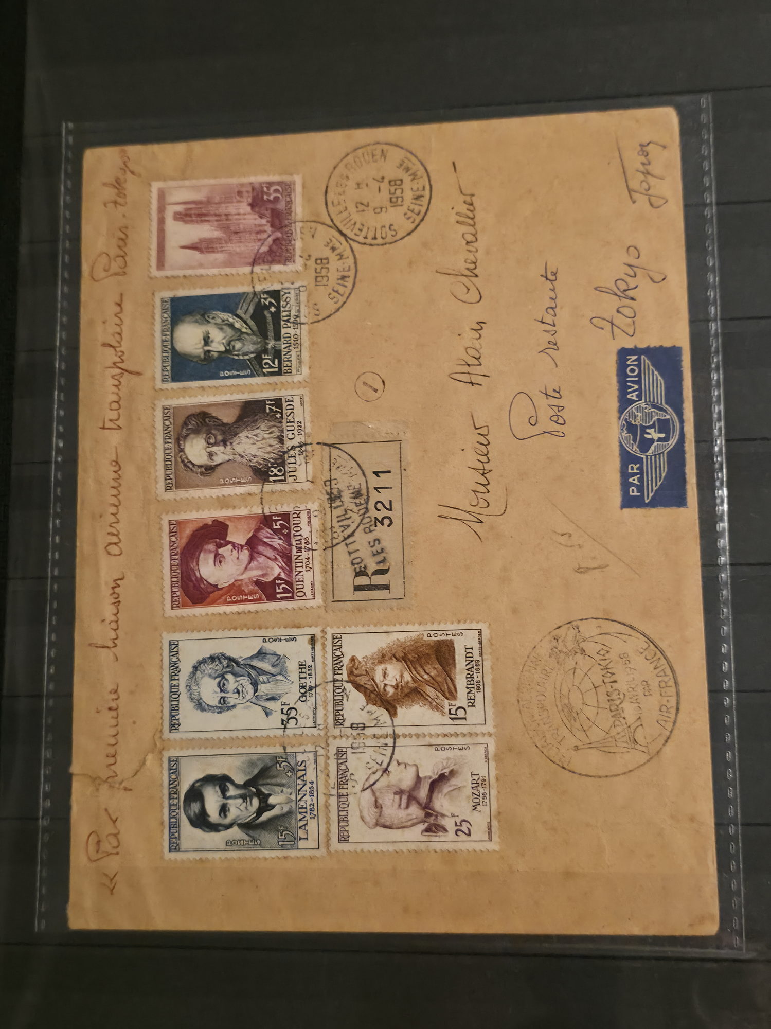 a brown envelope with stamps and stamps on it