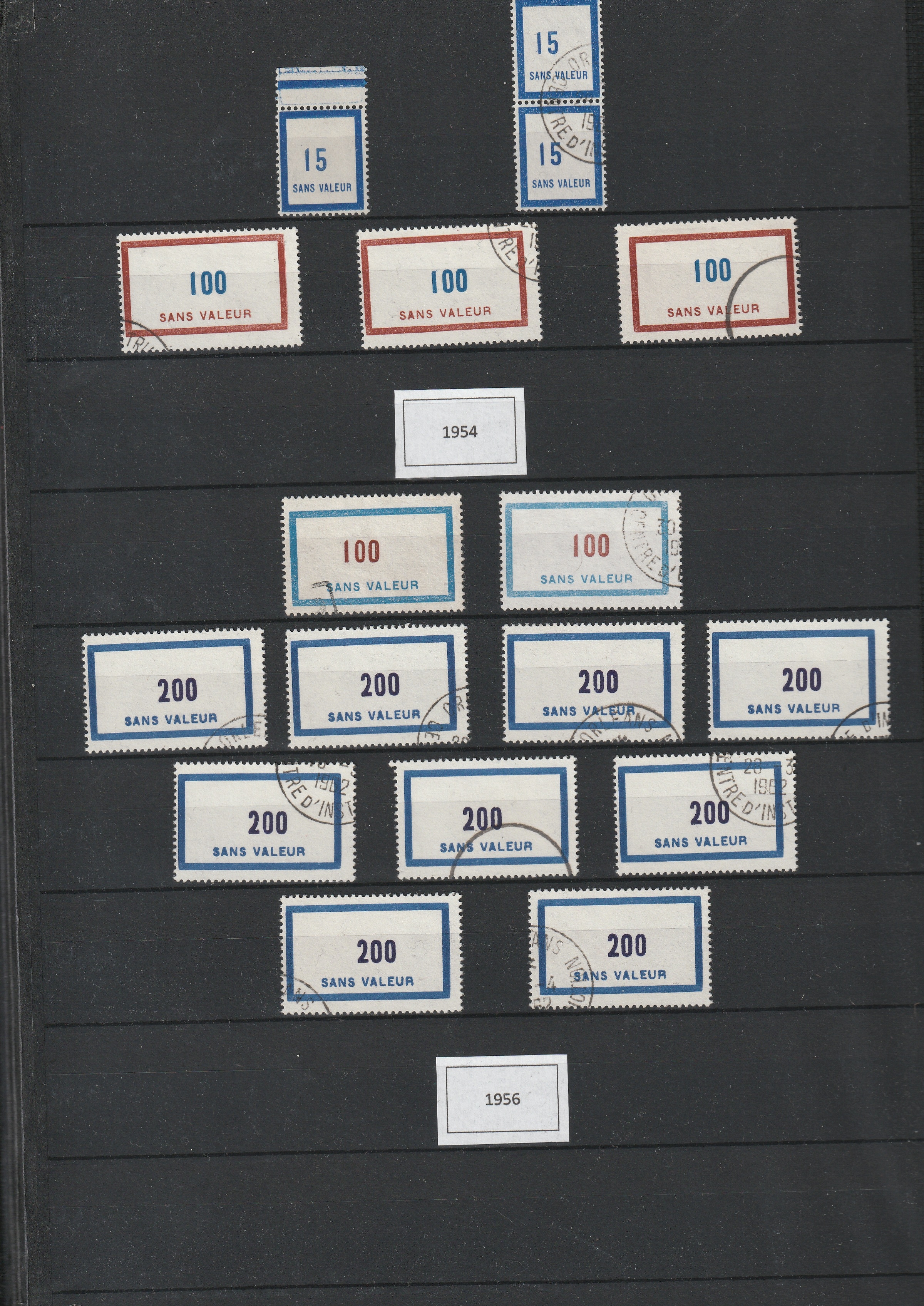 a group of postage stamps on a black board