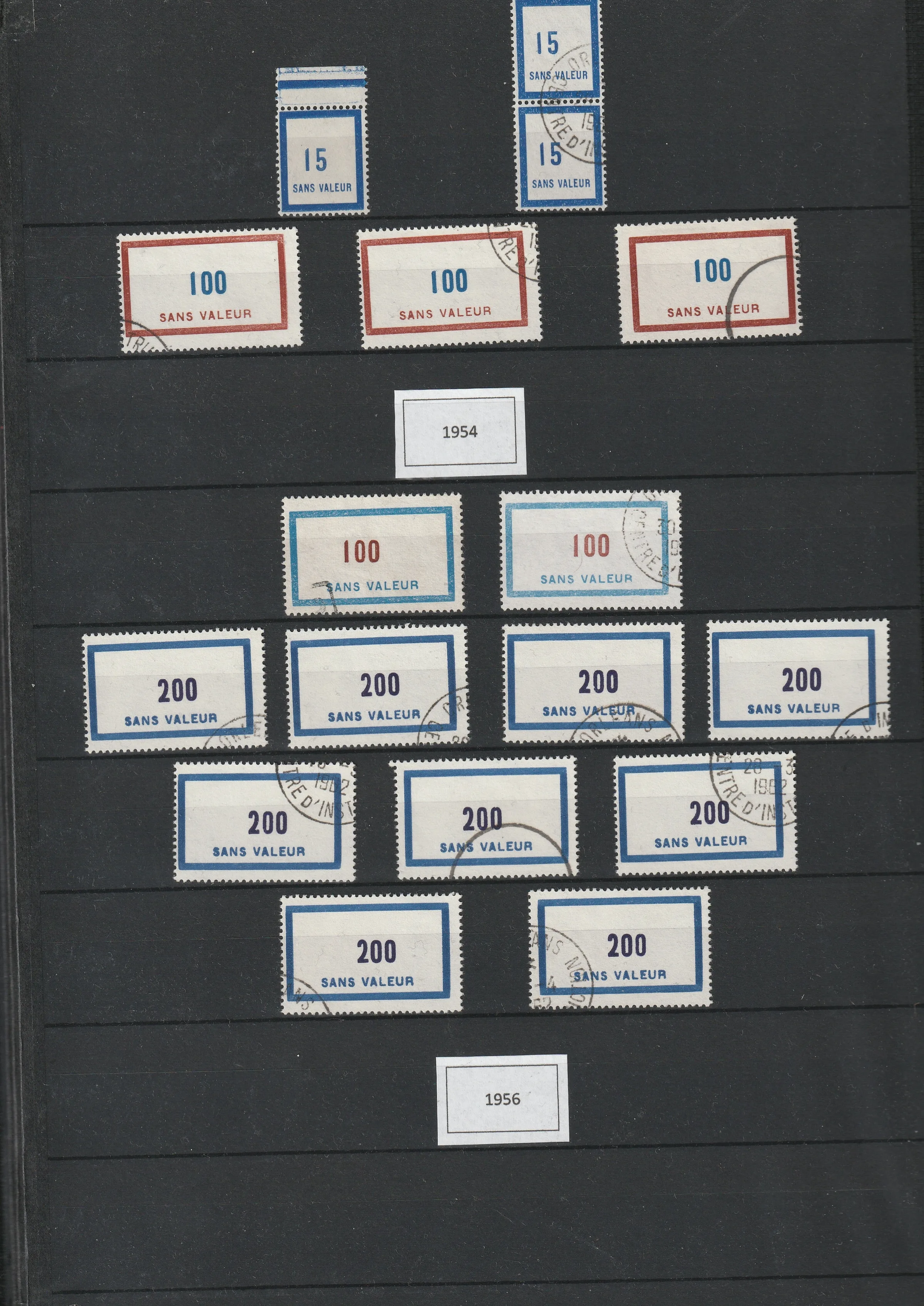 a group of postage stamps on a black board