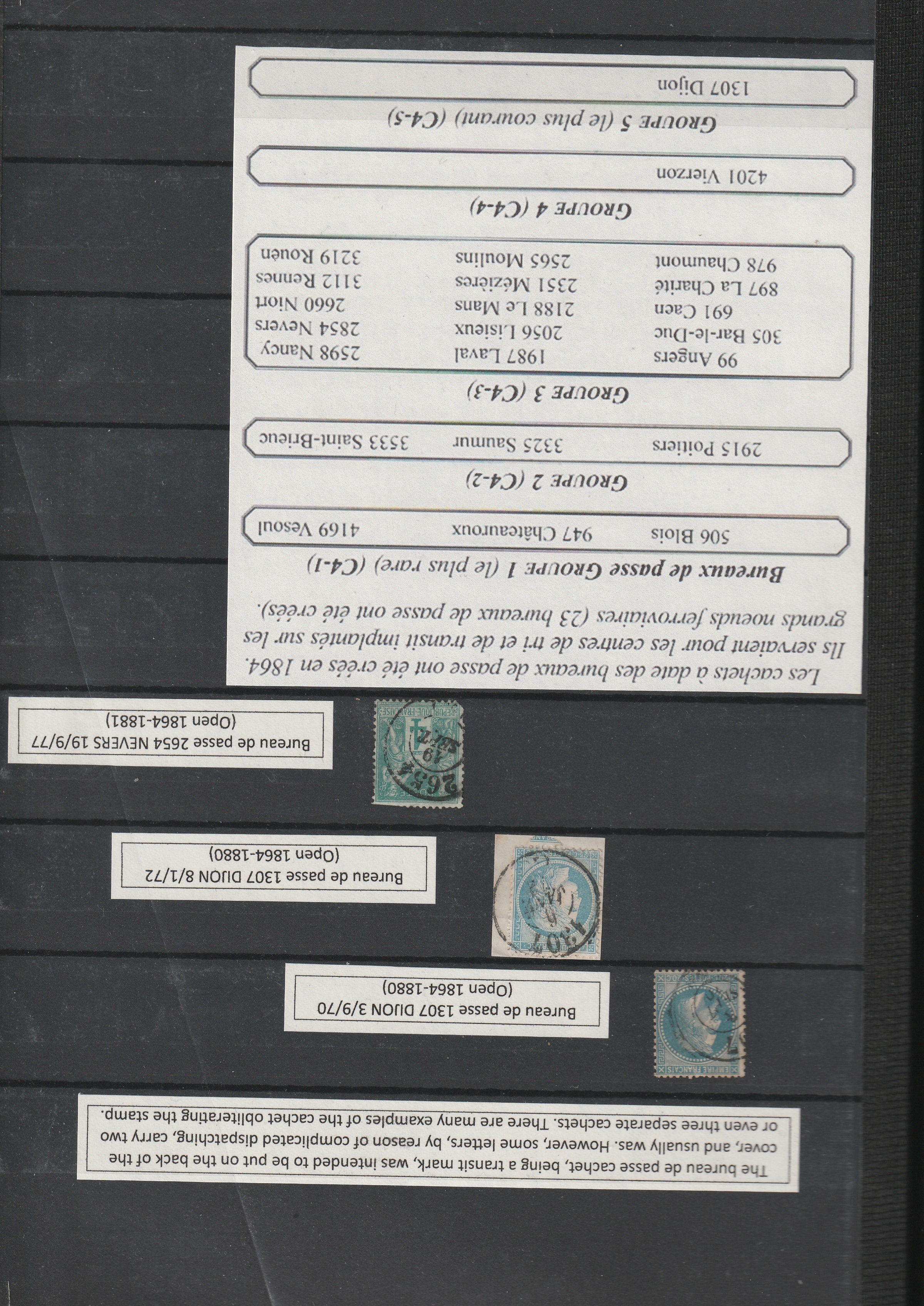 a group of postage stamps on a black board
