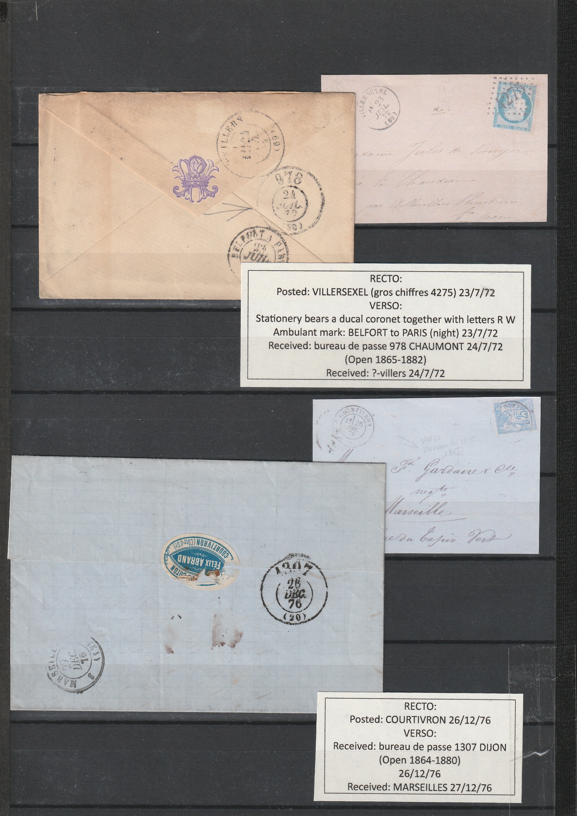 a group of envelopes with stamps