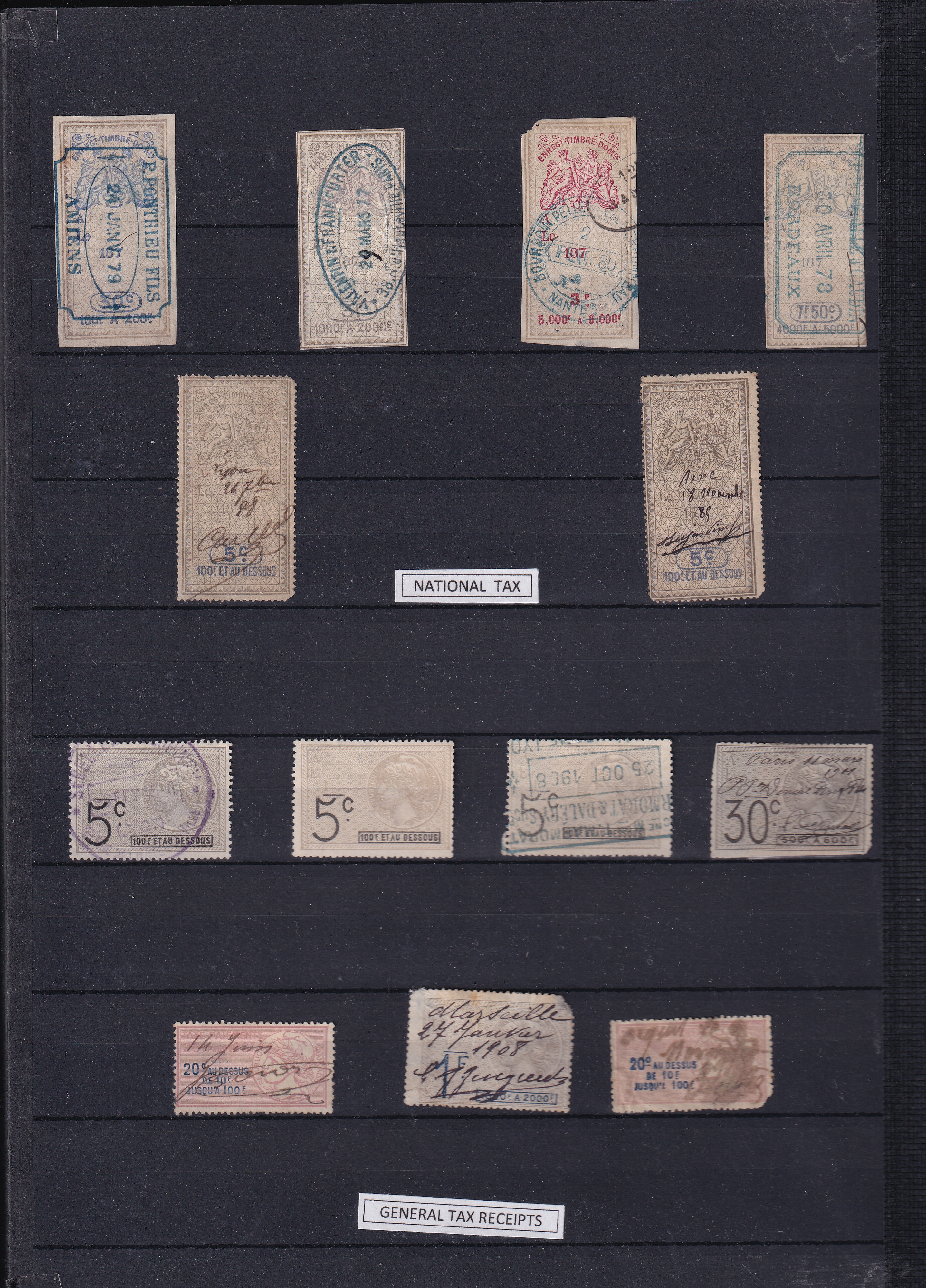 a collection of stamps on a black board