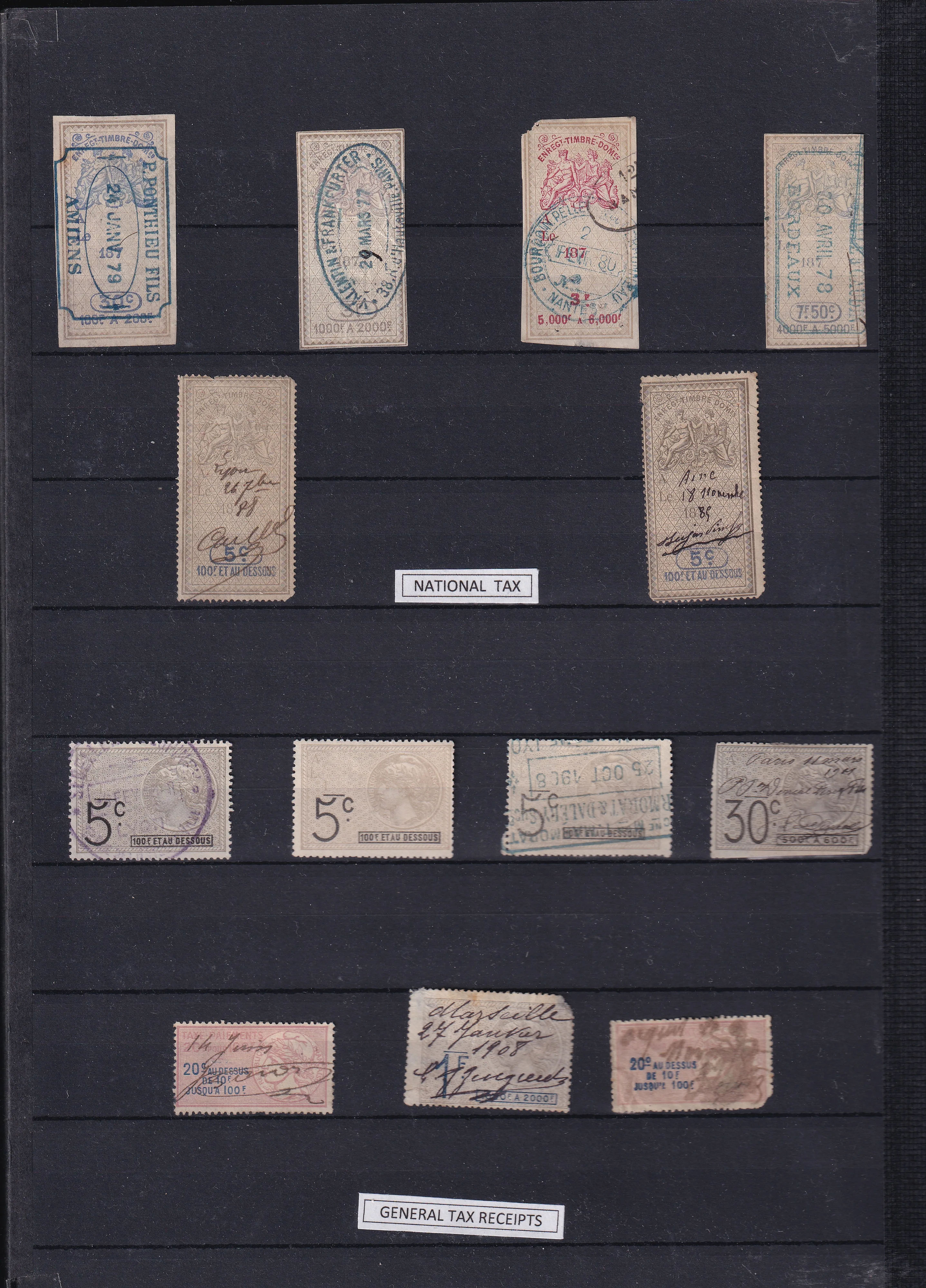 a collection of stamps on a black board
