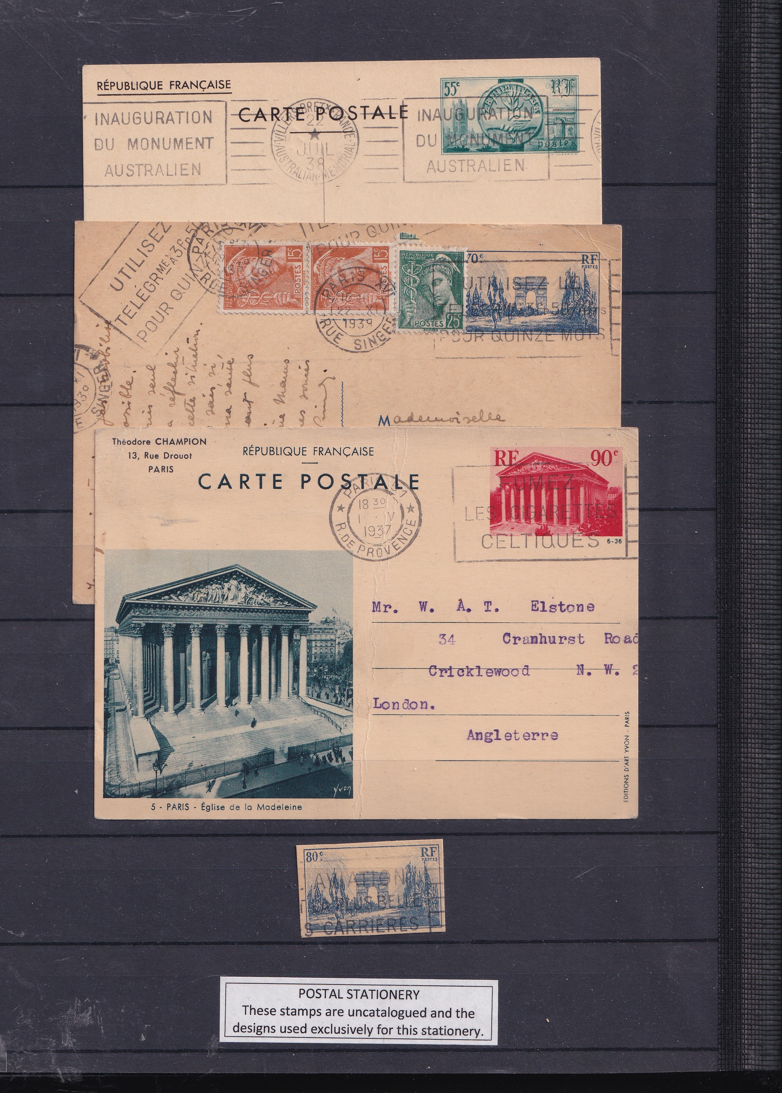 a group of old postcards on a black board