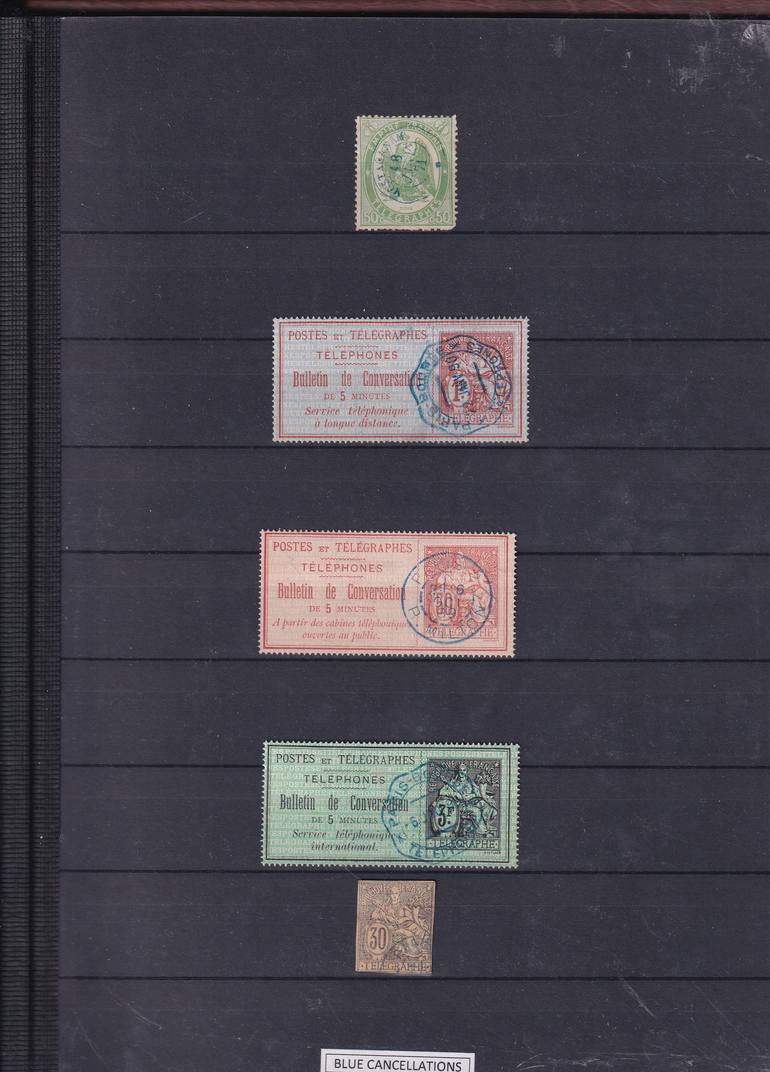 a group of stamps on a black background