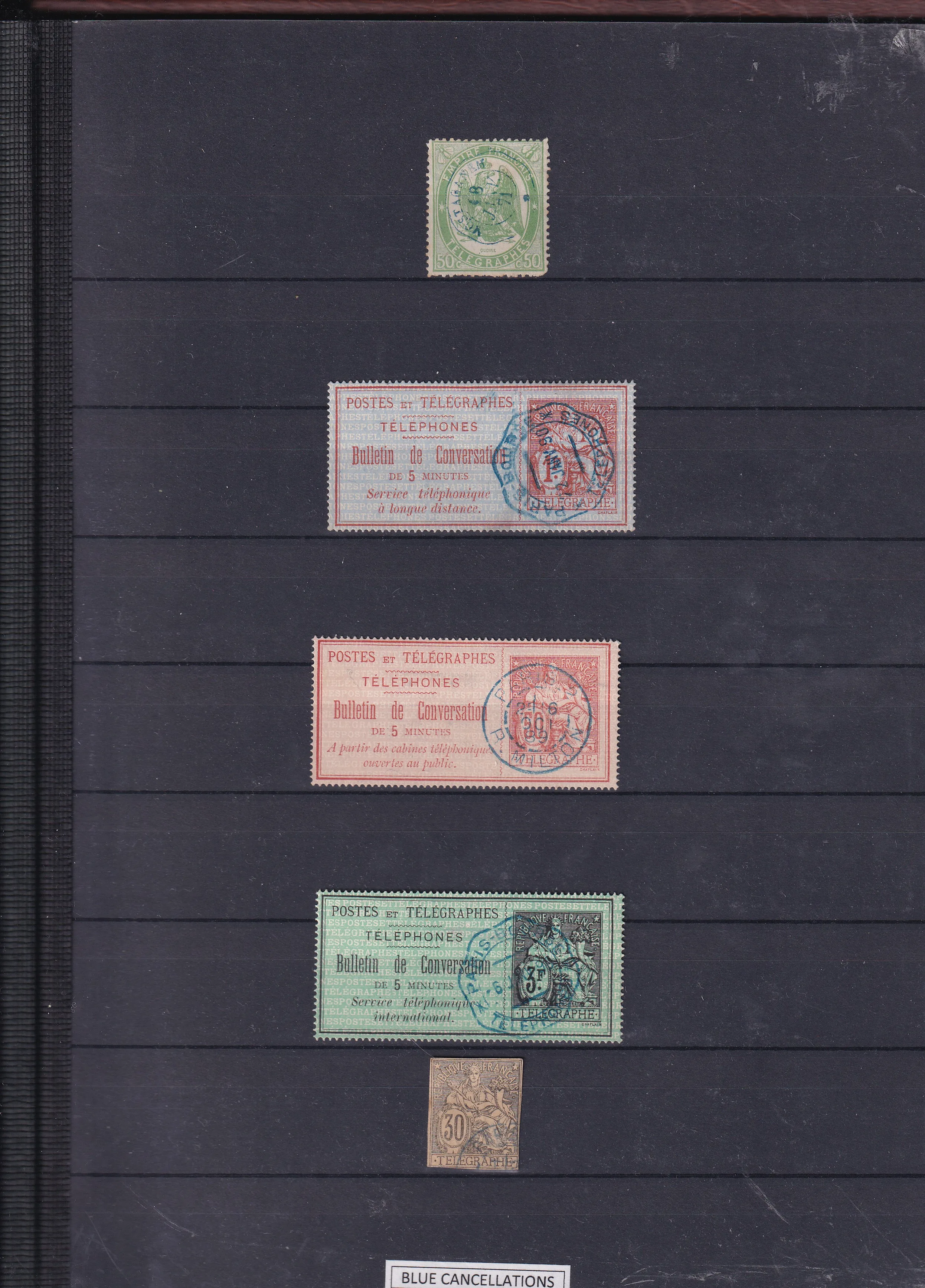 a group of stamps on a black background