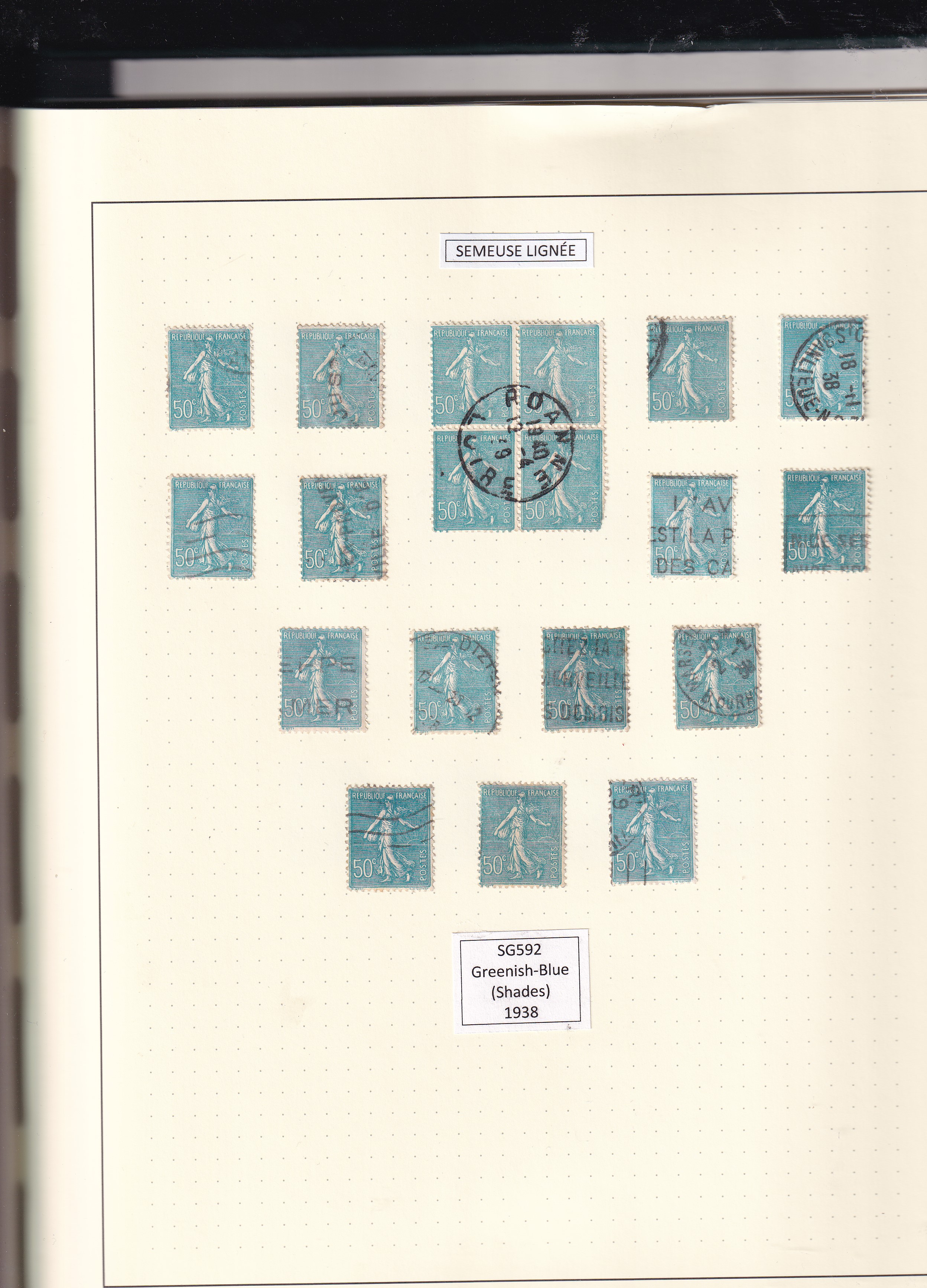 a collection of stamps in a notebook