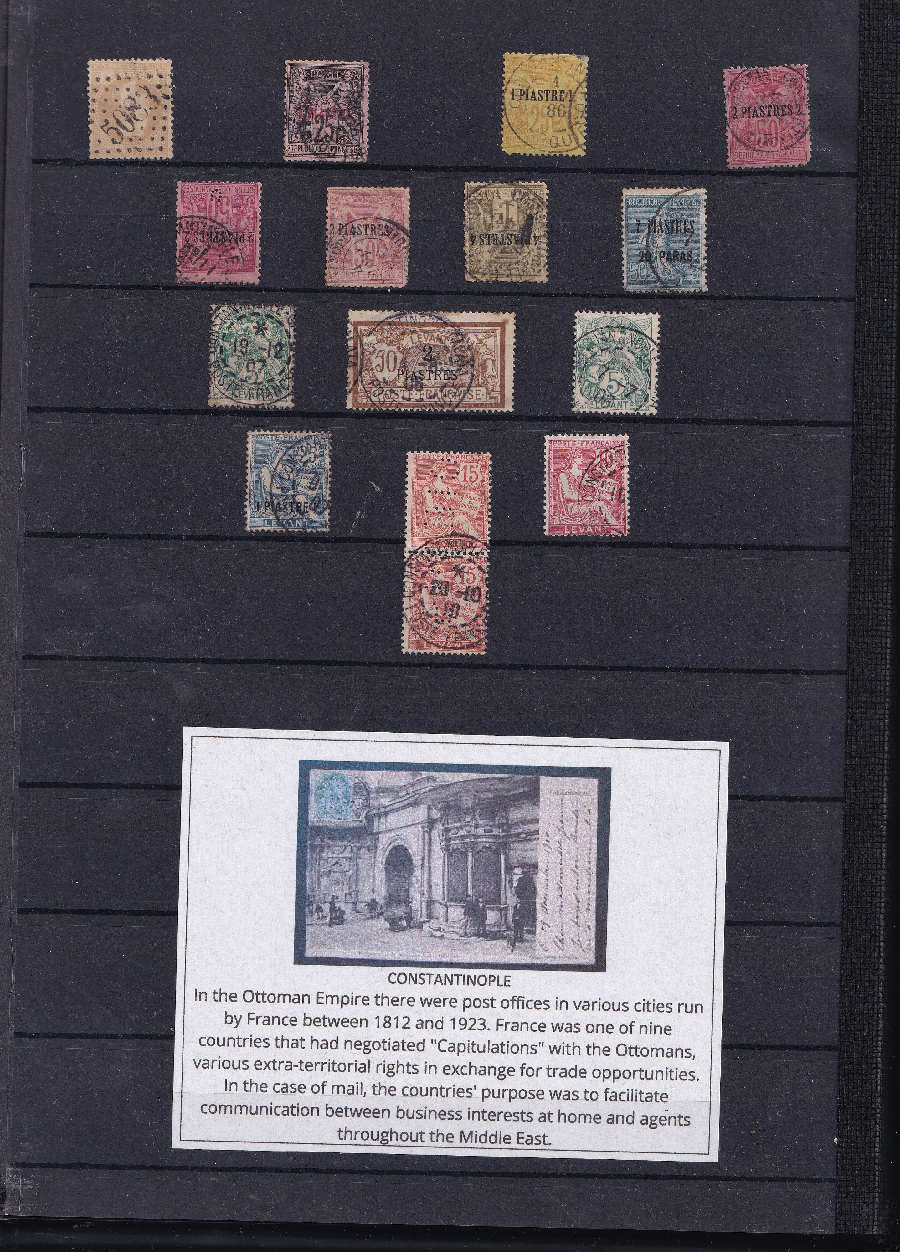a collection of postage stamps on a black board