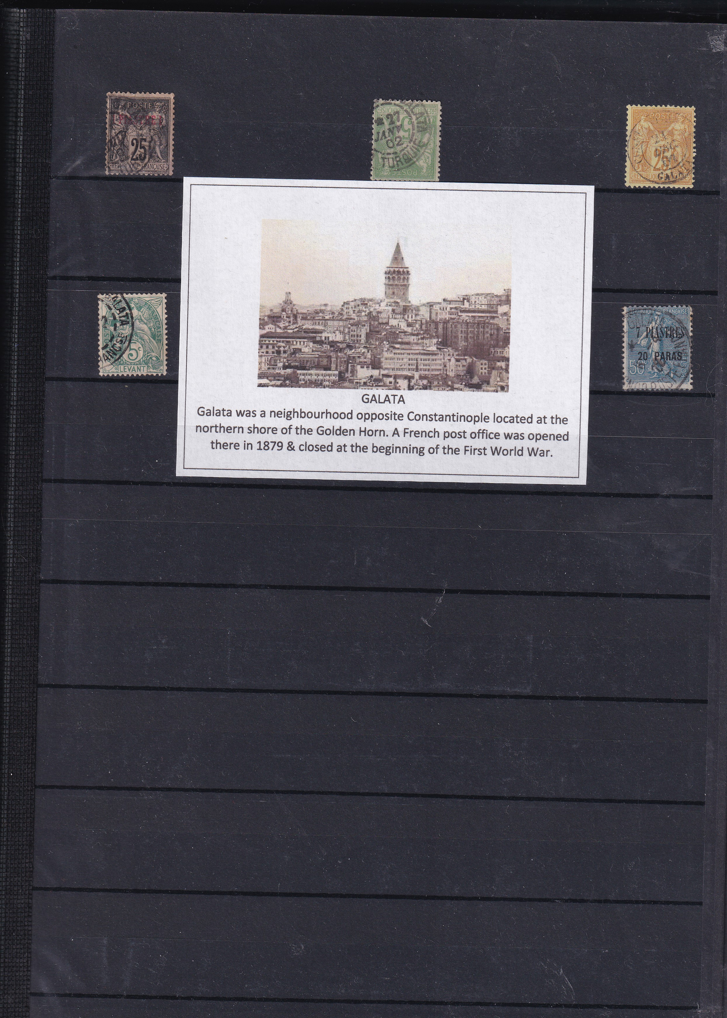 a black board with postage stamps and a piece of paper