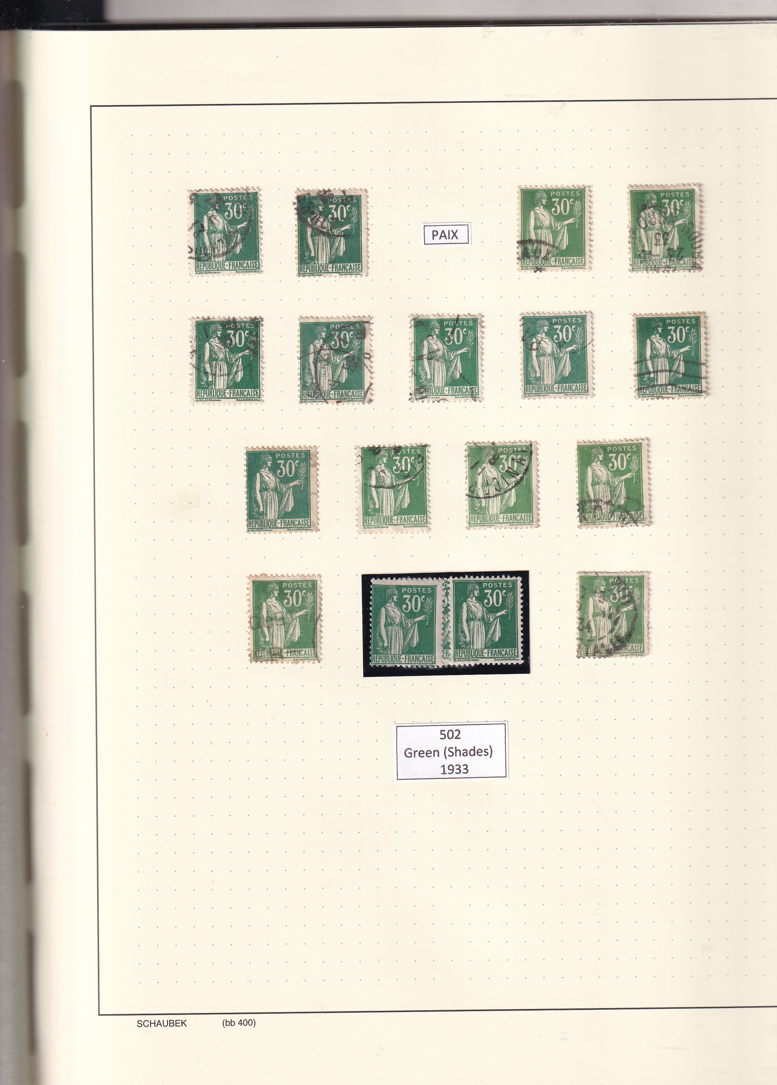 a collection of stamps in a notebook