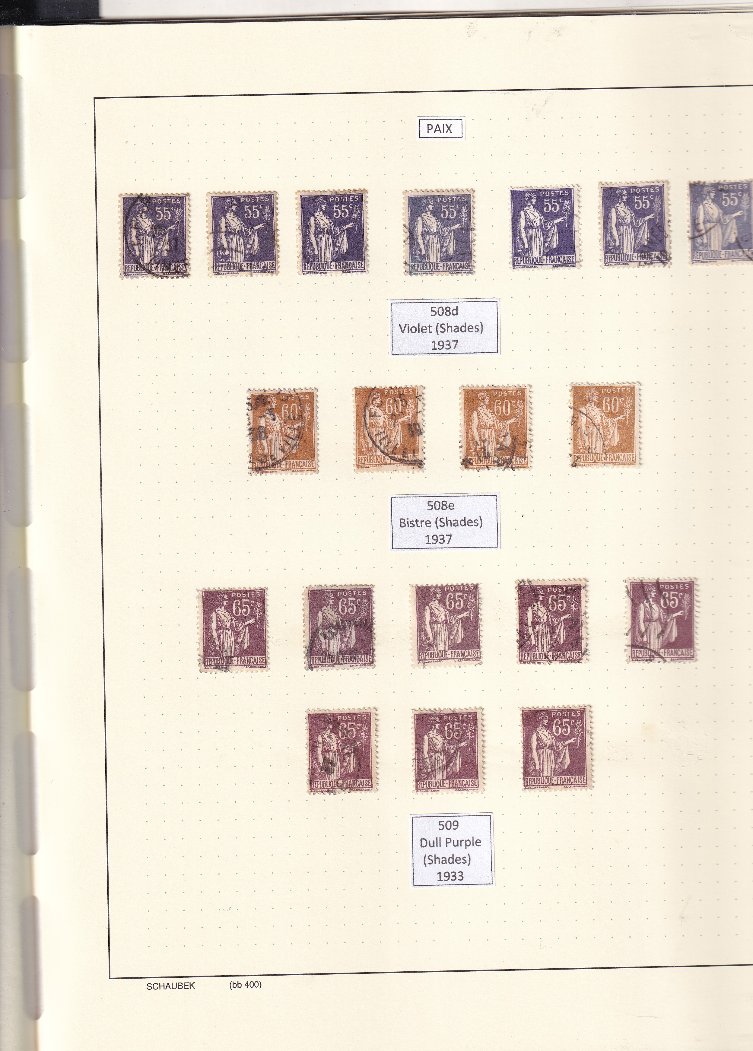 a collection of postage stamps in a notebook