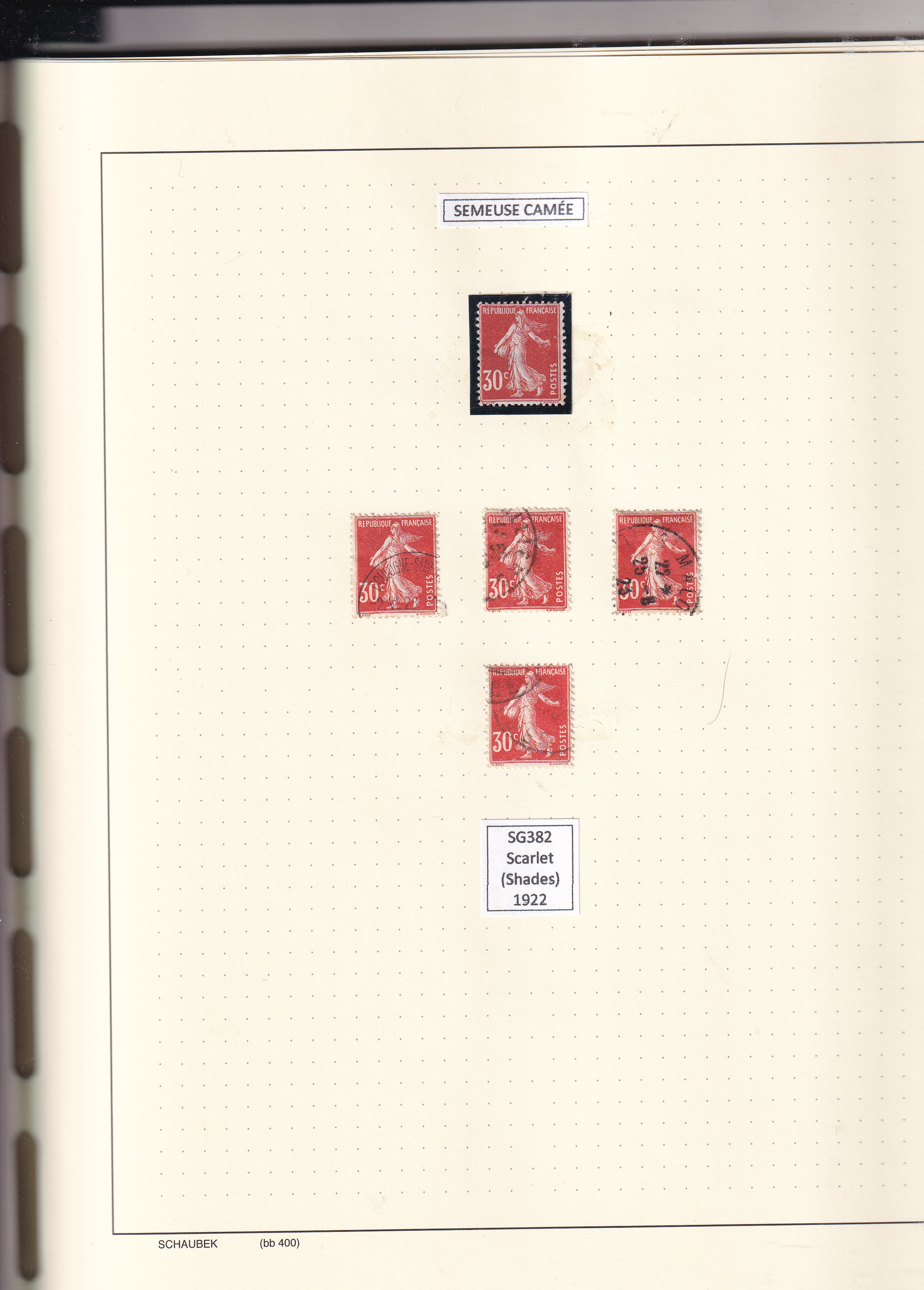 a collection of postage stamps in a notebook