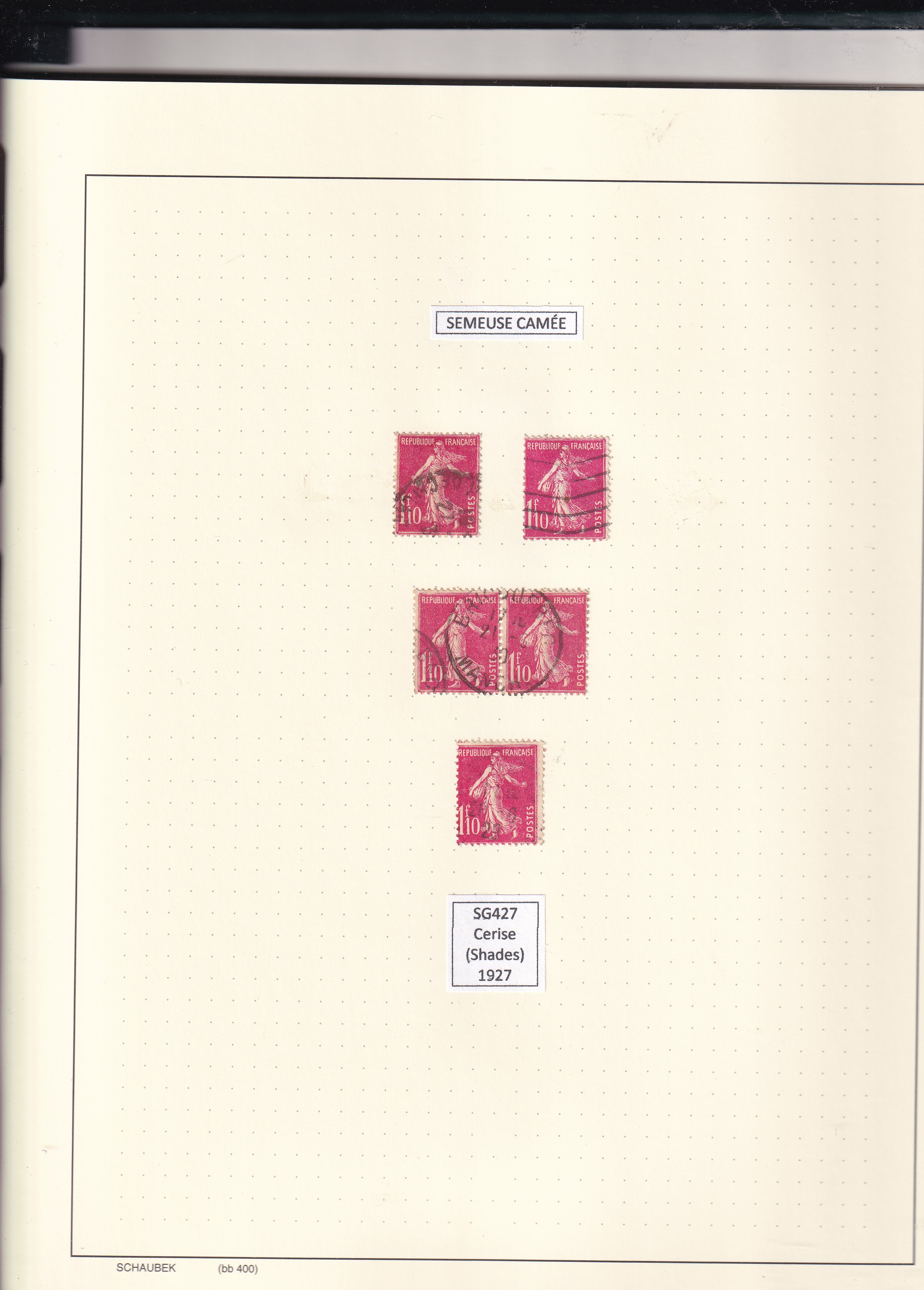 a collection of postage stamps in a notebook