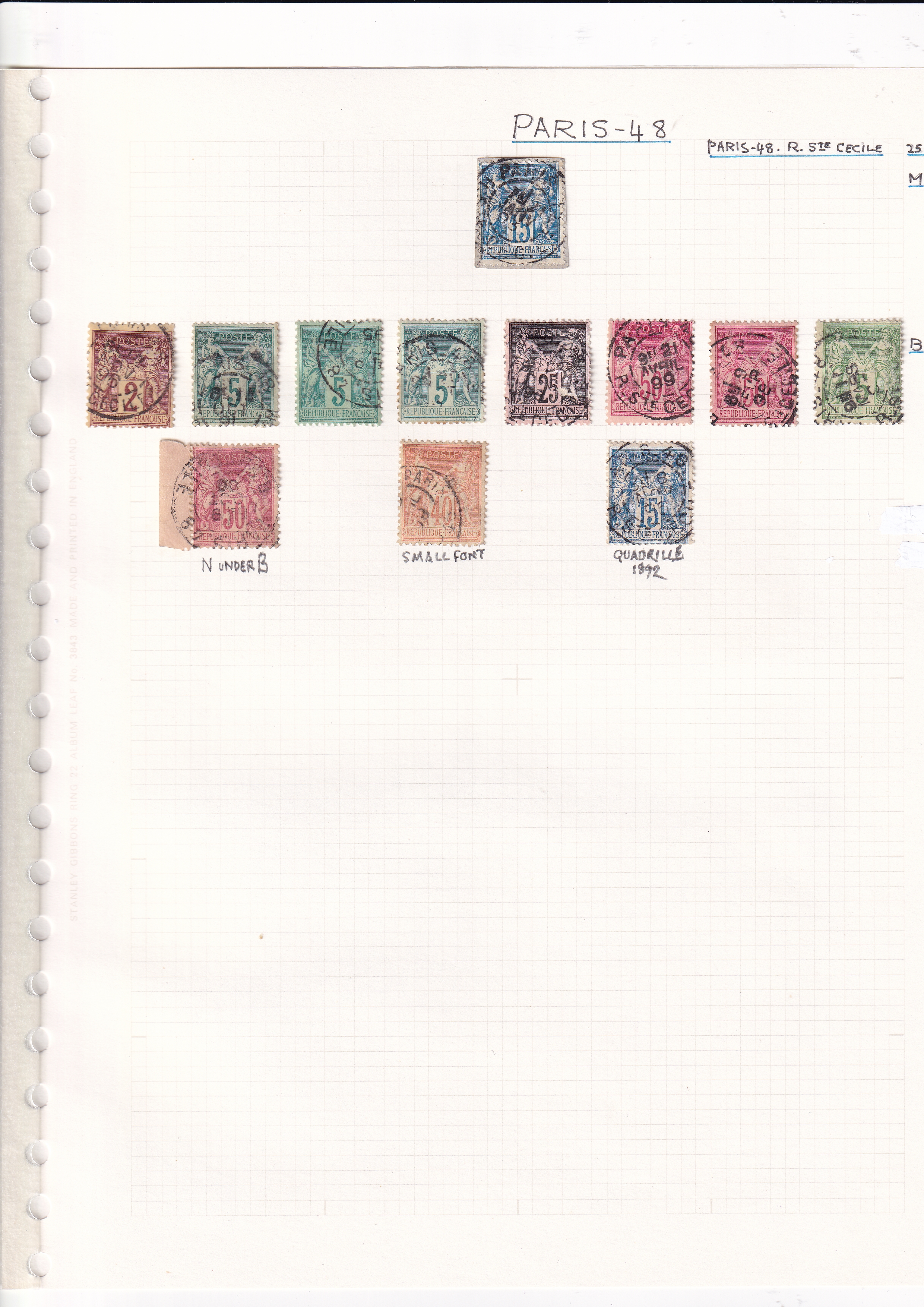 a collection of postage stamps on a white sheet of paper