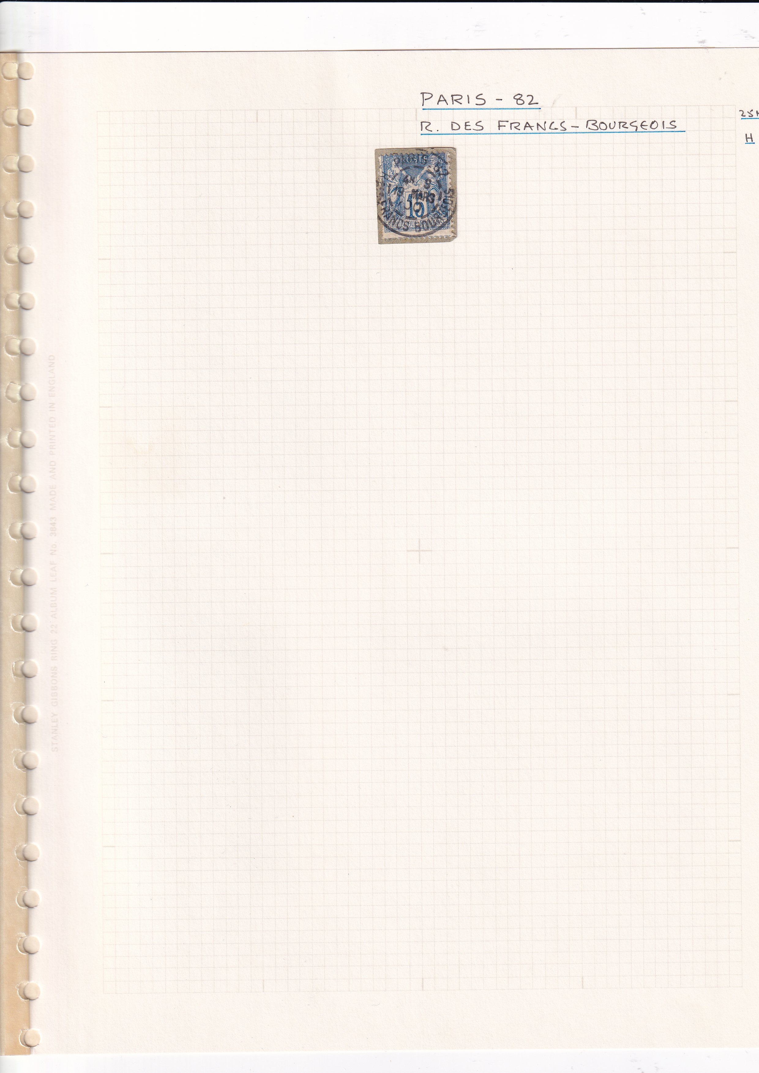 a white notebook with a blue and white rectangular object