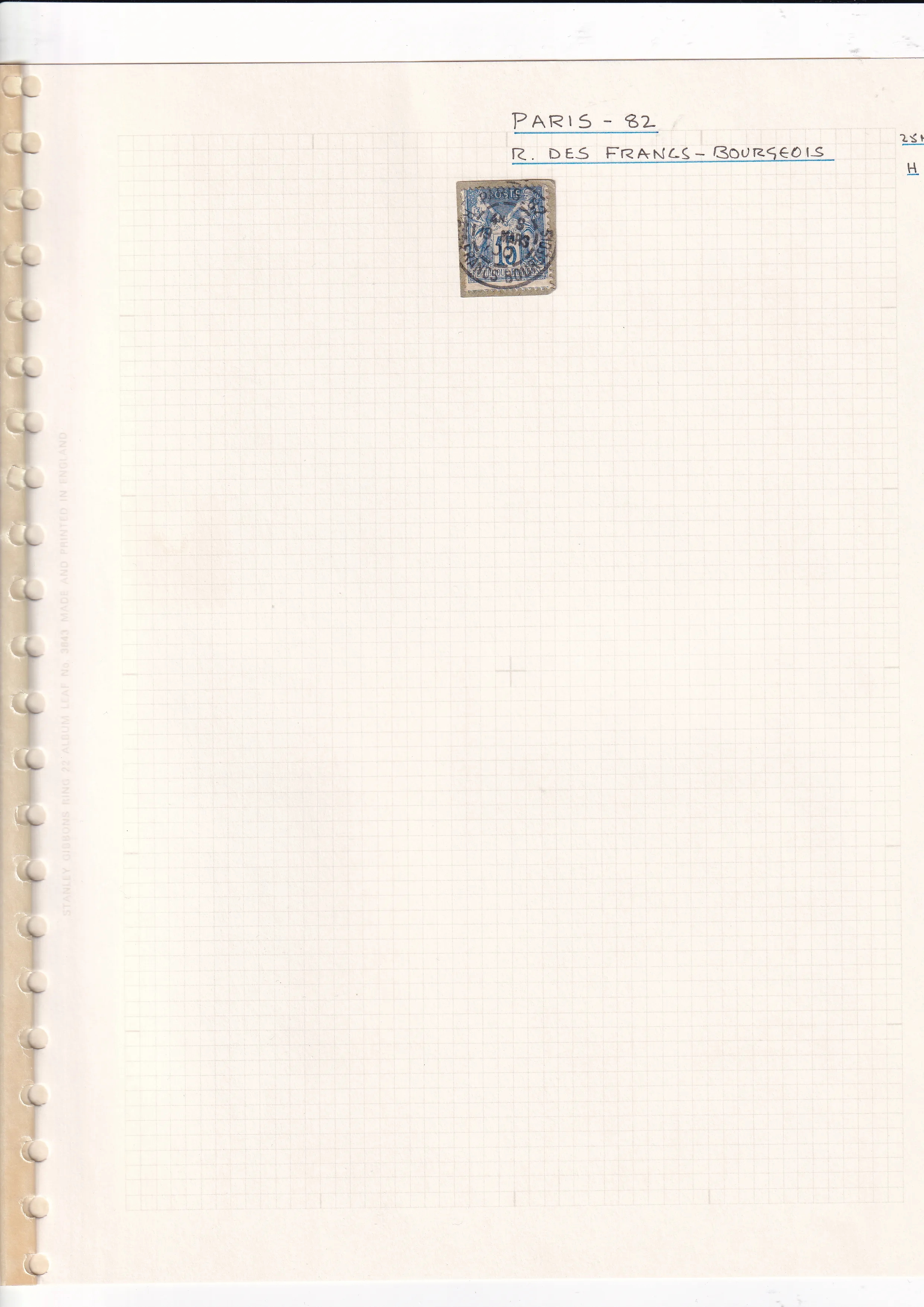 a white notebook with a blue and white rectangular object